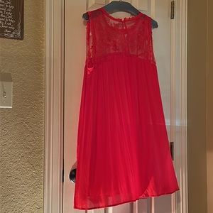 Red sleeveless swing dress.